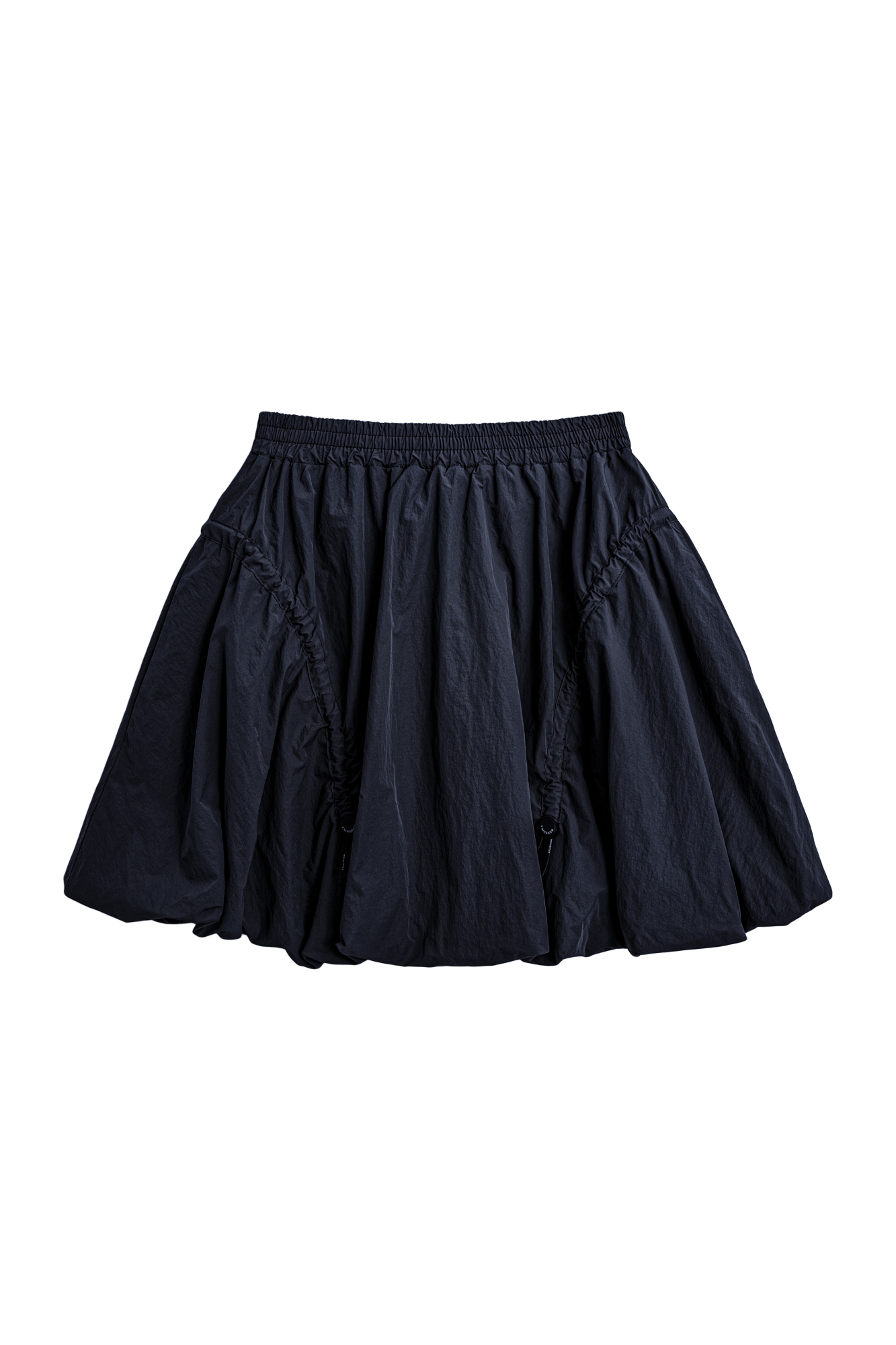 Юбка-баллон длины мини из нейлона. Модель с поясом на резинке и регулируемыми оборками по бокам.