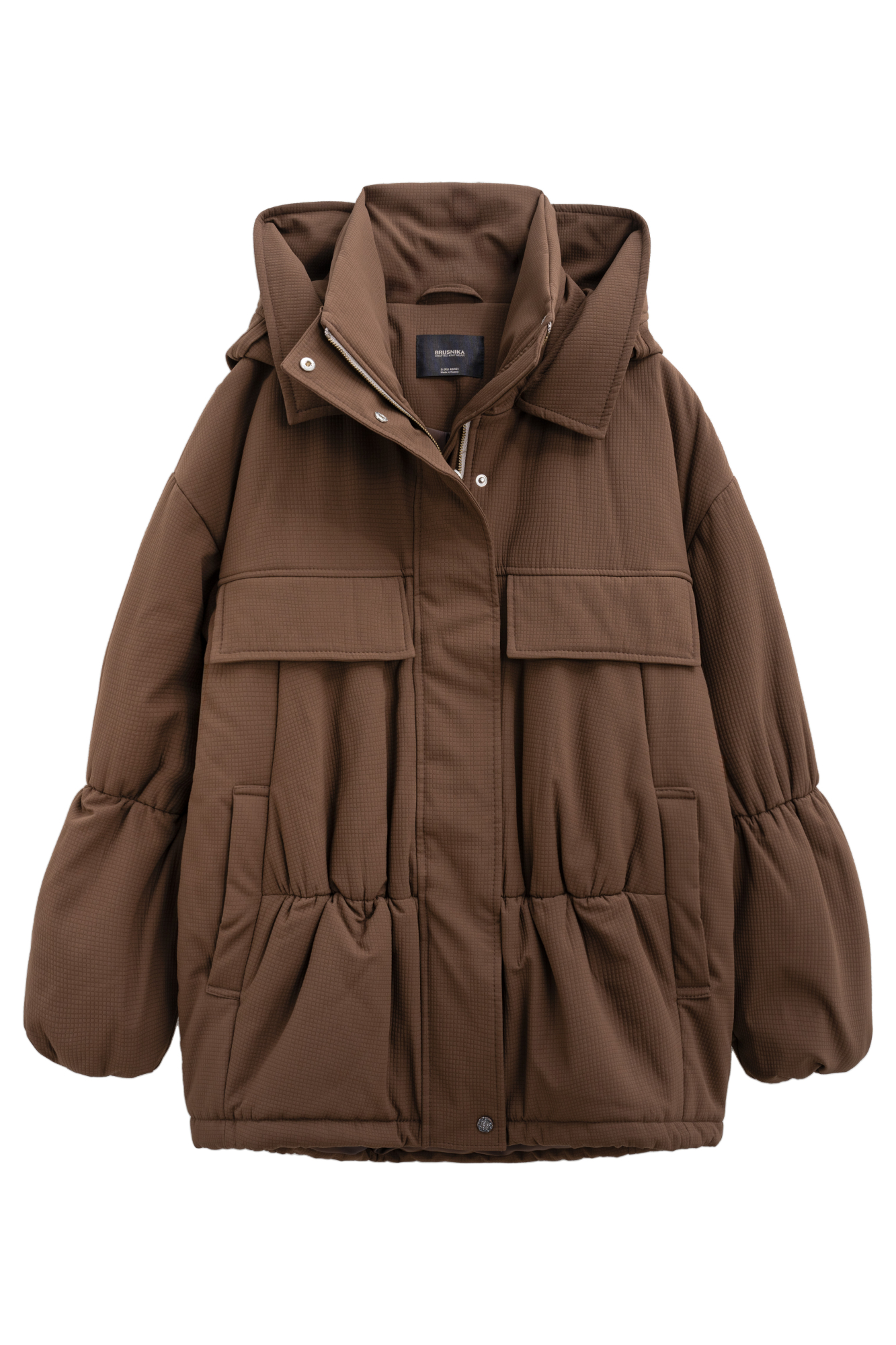 Длинная куртка на синтепоне из текстурной ткани. Модель свободного силуэта со спущенной линией плеча, накладными и боковыми карманами, воротником-стойкой и капюшоном. Изделие на подкладке. Застежка на молнию под планкой с кнопками.