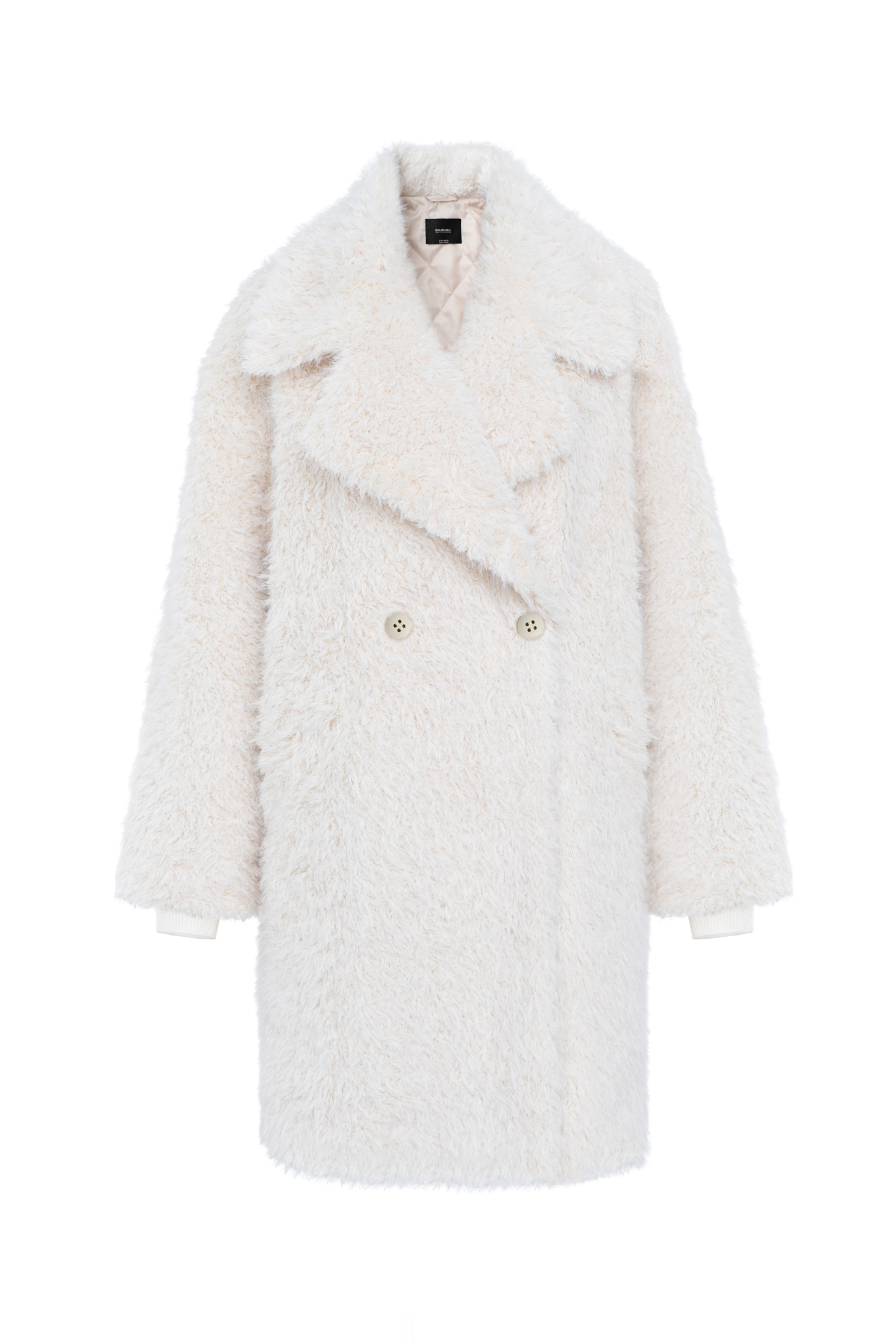 Объемная двубортная шуба длины миди из экомеха. Модель свободного силуэта со спущенной линией плеча, длинными трикотажными манжетами и застежкой на пуговицы. Изделие выполнено на подкладке.