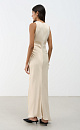 Атласное платье длины макси. Модель приталенного силуэта, с круглым вырезом горловины, без рукавов. Модель декорирована асимметричной юбкой и драпировкой на талии.