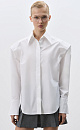 Рубашка из хлопка. Модель прямого кроя, с длинными рукавами с манжетами, классическим отложным воротником, увеличенными плечами и завязкой на спинке. Застежка на пуговицы под планкой. 