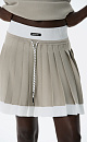 Трикотажная юбка плиссе длины мини из вискозы. Модель с широким эластичным поясом в рубчик. Пояс и нижняя часть юбки выполнены из пряжи контрастного цвета.