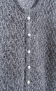 Трикотажный ажурный кардиган из шерсти с пайетками. Модель свободного силуэта с длинными рукавами, круглым вырезом горловины и застежкой на жемчужные пуговицы. 