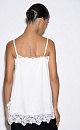 Топ из атласной вискозы, декорированный кружевом. Модель свободного силуэта на тонких бретельках.