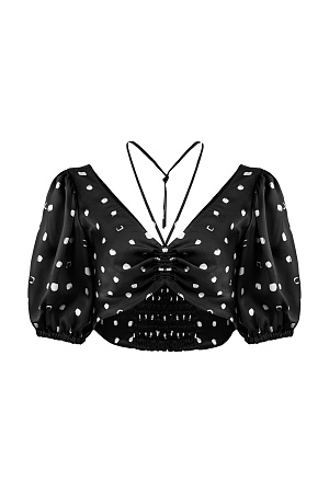 черный Атласный топ из 100% вискозы в горошек, с рукавами-фонариками и кулиской. Дополнить образ можно брюками в таком же стиле.