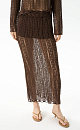 Полупрозрачная ажурная юбка. Модель приталенного силуэта длины миди с эластичным поясом в рубчик. Дополнить образ можно джемпером в таком же стиле.