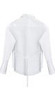Рубашка из хлопка. Модель прямого кроя, с длинными рукавами с манжетами, классическим отложным воротником, увеличенными плечами и завязкой на спинке. Застежка на пуговицы под планкой. 