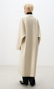 Шерстяное пальто из двусторонней ткани. Модель прямого кроя без воротника. Застежка на скрытые магнитные пуговицы. Изделие без подкладки. Модель декорирована асимметричным лацканом. Пояс из экокожи в комплекте.