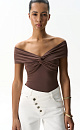 Топ из модала с открытой линией плеч. Модель приталенного силуэта, без рукавов. Изделие декорировано перекрутом на груди и драпировкой на лифе. 