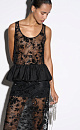 Кружевной топ с цветочным орнаментом, расшитый пайетками. Модель с глубоким U-вырезом на широких бретельках. Изделие декорировано баской.