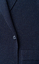 Трикотажный двубортный жакет из шерсти с добавлением вискозы и шелка. Модель прямого кроя, с лацканами, двумя накладными карманами и валиками на манжетах. Застежка на пуговицы. Без подкладки. 