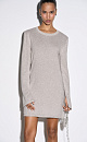 Трикотажное платье длины мини из вискозы с добавлением люрекса. Модель свободного силуэта с круглой горловиной и длинными рукавами. Края изделия декорированы валиком.