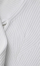 Укороченный трикотажный топ из вискозы. Модель приталенного силуэта, с декоративными горизонтальными разрезами на талии, длинными рукавами, декорированными люверсами и шнуровкой, и круглым вырезом горловины. Изделие выполнено в широкий рубчик. Дополнить образ можно юбкой в таком же стиле.