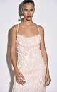 Вечернее платье-футляр длины миди, декорированное пайетками и бахромой. Модель по фигуре на тонких регулируемых бретельках. 