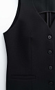 Классический жилет из поливискозы. Модель приталенного силуэта с имитацией карманов и v-образным вырезом. Застежка на пуговицы.