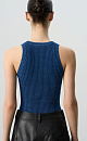 Трикотажное боди из хлопка с добавлением эластана. Модель без рукавов, с круглым вырезом горловины. Изделие выполнено в рубчик. Застежка на бельевые крючки. Цвет - имитация вареной джинсы.
