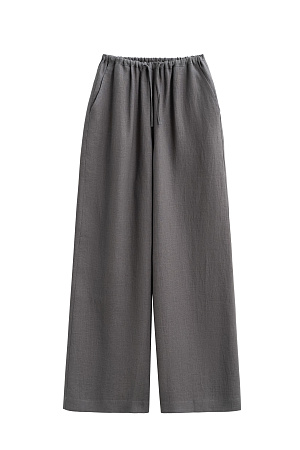 серый Широкие брюки из 100% льна. Модель свободного прямого кроя с врезными карманами по бокам. Изделие выполнено с поясом на узкой резинке, дополненным кулиской.
