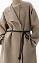 Шерстяное пальто из двусторонней ткани. Модель прямого кроя без воротника. Застежка на скрытые магнитные пуговицы. Изделие без подкладки. Модель декорирована асимметричным лацканом. Пояс из экокожи в комплекте.