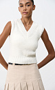 Трикотажный жилет из шерсти. Модель свободного силуэта, с V-образным вырезом, выполненным в рубчик и широкой резинкой.