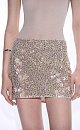 Юбка длины мини с объемным цветочным орнаментом, вышитым пайетками и бисером. Застежка на потайную молнию. Изделие выполнено на подкладке.