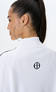 Трикотажный бомбер из вискозы. Модель свободного силуэта с невысоким воротником-стойкой, рукавом реглан, двумя карманами спереди и застежкой на молнию. Низ изделия и манжеты рукавов выполнены на резинке и дополнены кружевом. Изделие декорировано жаккардовым узором в виде кружева и логотипом бренда на спине.