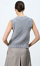 Трикотажный жилет из шерсти. Модель свободного силуэта, с V-образным вырезом, выполненным в рубчик и широкой резинкой.