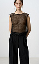 Прозрачный топ без рукавов, с круглым вырезом горловины. Модель декорирована пайетками. 