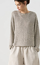 Трикотажный джемпер с голографическими пайетками. Модель свободного силуэта со спущенной линией плеча и круглой горловиной. Дополнить образ можно юбкой в таком же стиле. 
