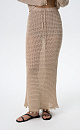 Трикотажная юбка длины макси на эластичном поясе с кулиской. Модель декорирована тесьмой с крупными бусинами. Дополнить образ можно джемпером в таком же стиле.&nbsp;&nbsp;