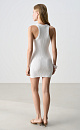 Платье длины мини из фактурного трикотажа на основе вискозы. Модель приталенного силуэта, без рукавов, на широких бретельках, с U-образным вырезом горловины. Изделие выполнено в широкий рубчик. 