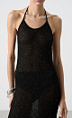 Трикотажное платье длины миди из хлопка с добавлением вискозы. Изделие декорировано мелкими пайетками. Модель прямого кроя с открытой спиной и двумя лямками-завязками на шее. Без подкладки.