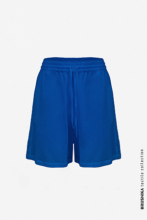 синий Шорты из 100% хлопка. Модель свободного силуэта на кулиске.