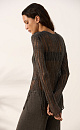 Полупрозрачный джемпер, выполненный изо льна с добавлением люрекса. Модель по фигуре с круглым вырезом горловины и невысоким разрезом сбоку. Изделие с подплечниками.
